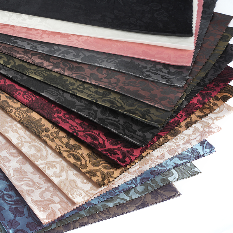 Jacquard med poleret lutblomst af polyester